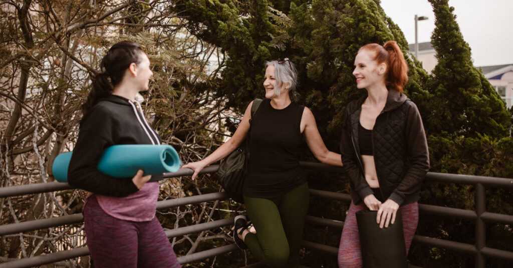 40 plus women fit, happy, and confident. Talking after a yoga class.